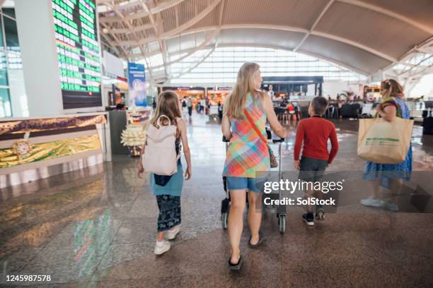 walking through airport - bali airport stock pictures, royalty-free photos & images