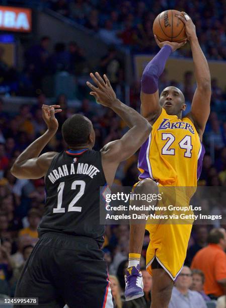 April 06: Los Angeles Lakers forward Kobe Bryant fades back for a jump shot against Los Angeles Clippers forward Luc Richard Mbah a Moute in the...