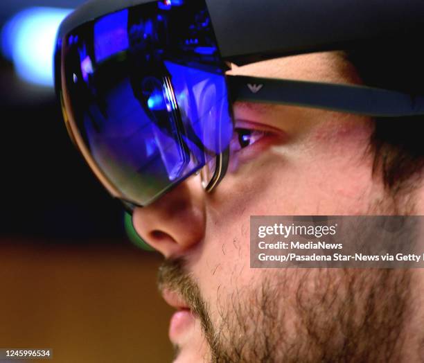 May 17: Pasadena Star-News reporter Jason Henry looking through the Microsoft HoloLens mixed reality headset, view the Martian surface 3D simulation...