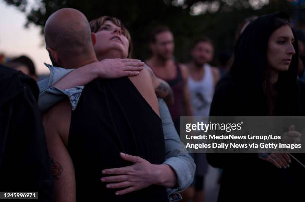 June 12: Janette Vorous hugs her friend Christopher Vasquez, who in his early 20s spent time at the Orlando gay nightclub where 50 were killed, as...