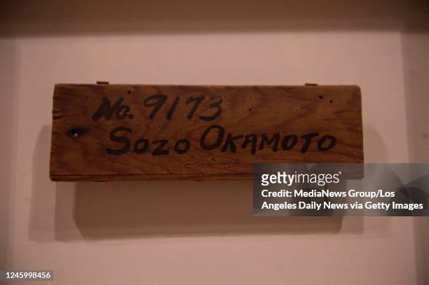 October 07: A family's identification sign in the exhibit "Manzanar: The Wartime Photographs of Ansel Adams," at the Skirball Cultural Center on...