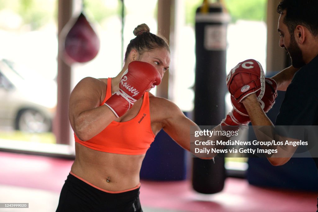 UFC women's bantamweight champion Ronda Rousey works with coach... News ...