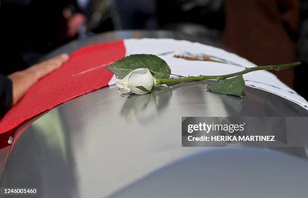 White rose sits on top of a coffin of one of the guards of the Cereso 3 prison killed on January 1, 2023 during a riot in which 30 inmates escaped,...