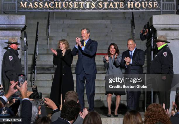 Boston, MA Massachusetts Governor Charlie Baker takes his Lone Walk done the stairs of the Massachusetts State House with his wife Lauren, left, Lt....