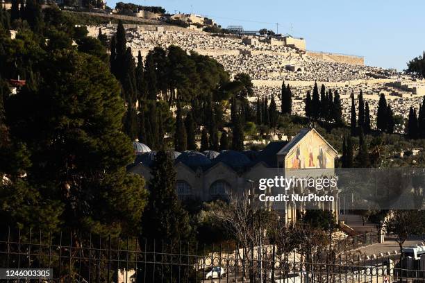 View of the Jewish Cemetery on the Mount of Olives, Gethsemane garden and Church of the Nations in Jerusalem, Israel on December 29, 2022.