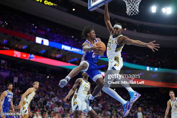 Tyrese Maxey of the Philadelphia 76ers passes the ball against Myles Turner of the Indiana Pacers in the second quarter at the Wells Fargo Center on...