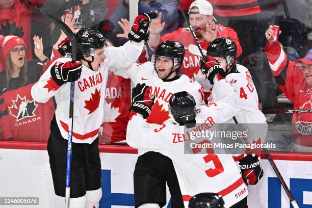 Adam Fantilli of Team Canada celebrates his goal with teammates Caedan Bankier, Olen Zellweger and Ethan del Mastro during the second period against...