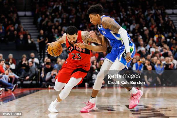 Fred VanVleet of the Toronto Raptors dribbles against MarJon Beauchamp of the Milwaukee Bucks during the first half of their NBA game at Scotiabank...