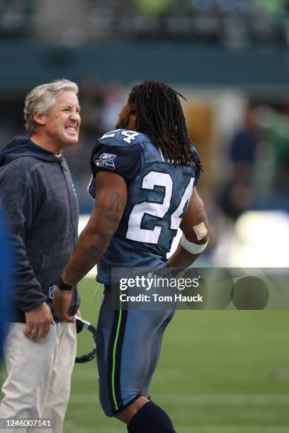 Pete Carroll, coach of the Seattle Seahawks talks to Marshawn Lynch during the game against the Baltimore Ravens at CenturyLink Field on November 13,...