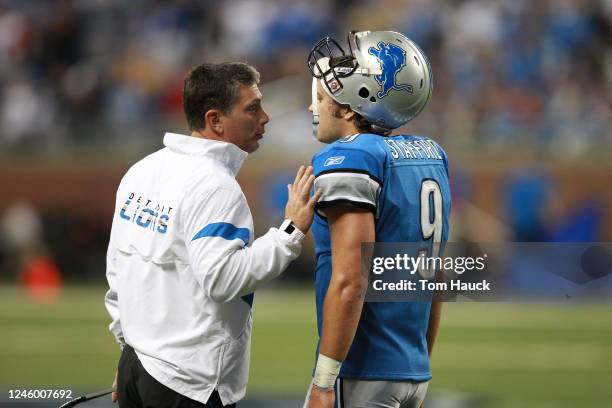 Matthew Stafford of the Detroit Lions talks with coach Jim Schwartz during the NFL game against the San Francisco 49ers at Ford Field on October 16,...