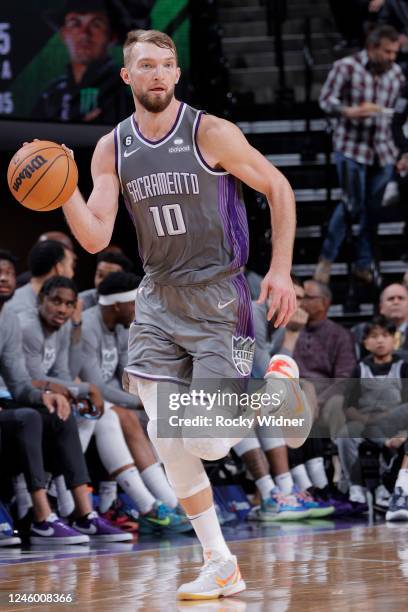 Domantas Sabonis of the Sacramento Kings dribbles the ball during the game against the Atlanta Hawks on January 4, 2023 at Golden 1 Center in...