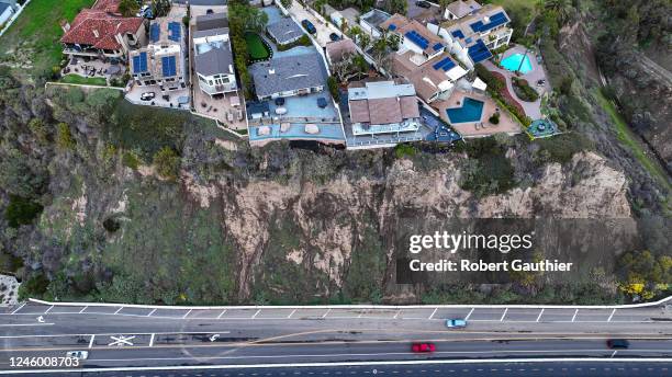 Dana Point, CA, Wednesday, January 4, 2023 - Unstable cliffs loom over Pacific Coast Highway as heavy rains threaten to create road-closing...