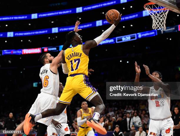 Dennis Schroder of the Los Angeles Lakers scores a basket and is fouled by Caleb Martin of the Miami Heat late in the second half at Crypto.com Arena...