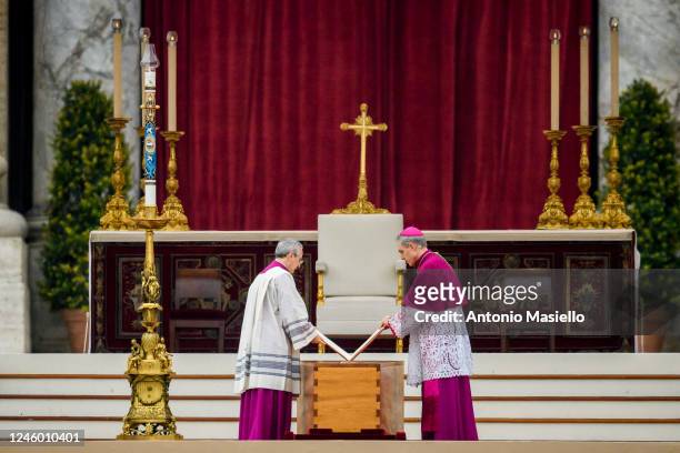 German Archbishop Georg Gänswein stands by the coffin of the late Pope Emeritus Benedict XVI at the start of his funeral mass at St. Peter's square...