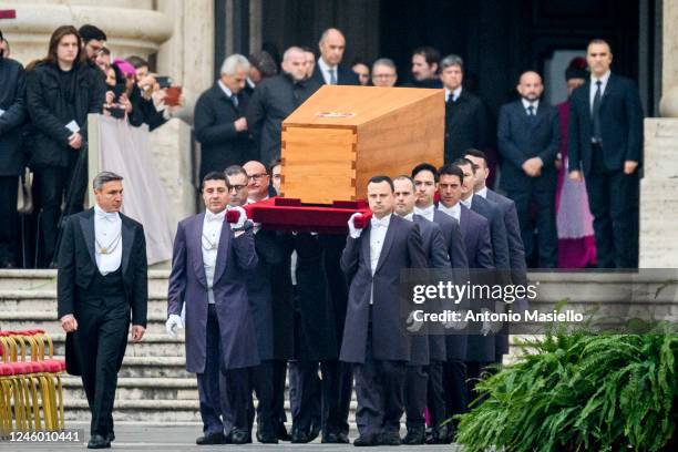 Pallbearers carry the coffin of Pope Emeritus Benedict XVI at the start of his funeral mass at St. Peter's square on January 5, 2023 in Vatican City,...