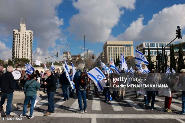 Israelis left wing protesters demonstrate in front of the High Court in Jerusalem against the leader of the ultra-Orthodox Shas party, Aryeh Deri, a...