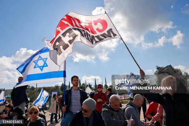 Israelis left wing protesters demonstrate in front of the High Court in Jerusalem against the leader of the ultra-Orthodox Shas party, Aryeh Deri, a...