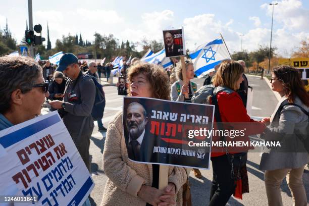 Israelis left wing protesters demonstrate in front of the High Court in Jerusalem against the leader of the ultra-Orthodox Shas party, Aryeh Deri, a...