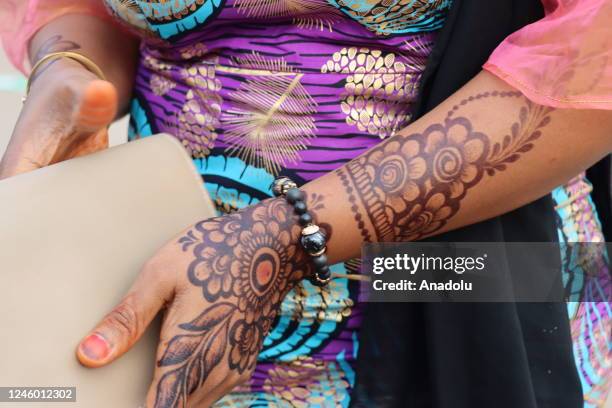 Woman with henna on her hands is seen in Yaounde, Cameroon on December 30, 2022. Muslims in Cameroon show their happy moments such as weddings,...