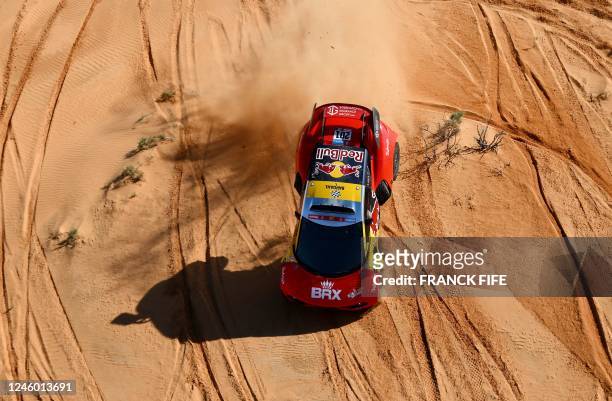 French driver Sebastien Loeb and Belgian co-driver Fabian Lurquin steers his Brx during the Stage 5 of the Dakar 2023 around Ha'il, Saudi Arabia, on...