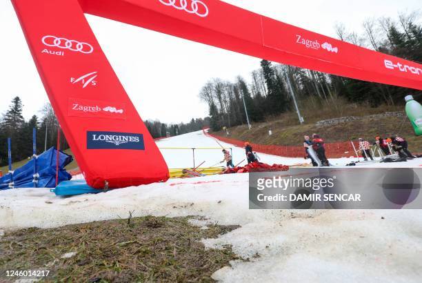 This photograph taken on January 5 shows patches were snow has melted away at the finish area of the Women slalom race at the 2022/23 FIS Alpine Ski...