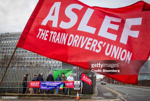 Demonstrators form a picket line near Crewe railway station, as train drivers represented by the Aslef union take part in strike action, in Crewe,...