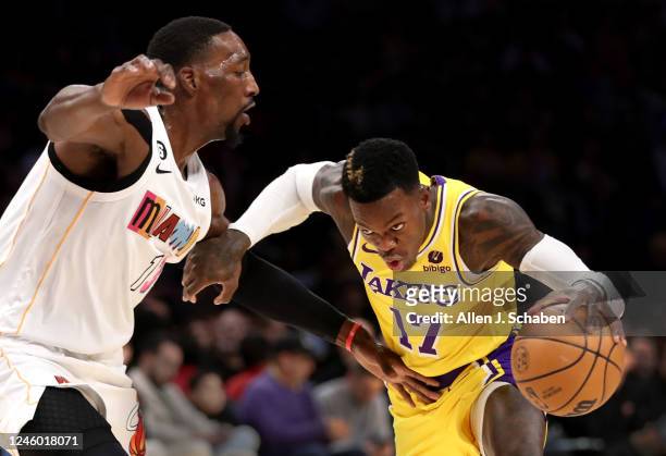 Los Angeles, CA Lakers guard Dennis Schroder, right, drives to the hoop past Heat center Bam Adebayo in the first half at Crypto.Com Arena in Los...