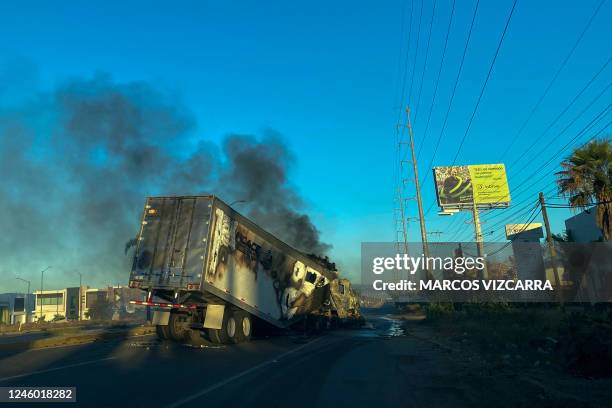 Burning truck is seen across a street during an operation to arrest the son of Joaquin "El Chapo" Guzman, Ovidio Guzman, in Culiacan, Sinaloa state,...