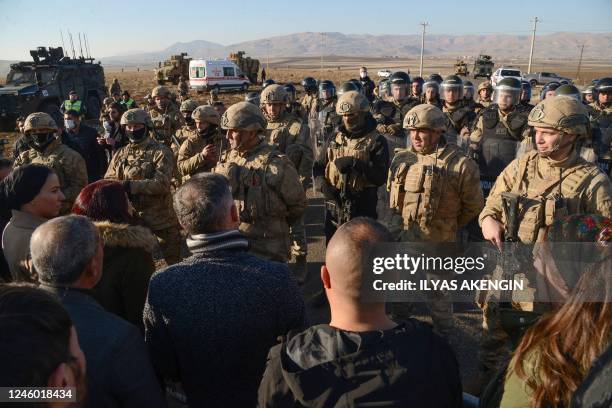 People face police as they try to attend the funeral of singer and political refugee Mir Perwer, one of three Kurds killed in a December 2022 attack...