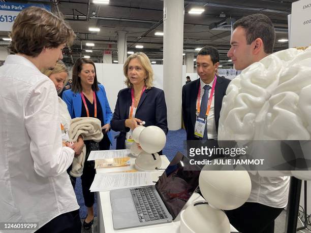 President of the Regional Council of Île-de-France, Valerie Pecresse , speaks with Emobot health tech co-founders Tanel Petelot and Samuel Lerman at...