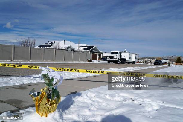 Pot of flowers along with a police crime scene trailer sits outside the home of Michael Haight on January 5, 2023 in Enoch, Utah. Haight, who was 42,...