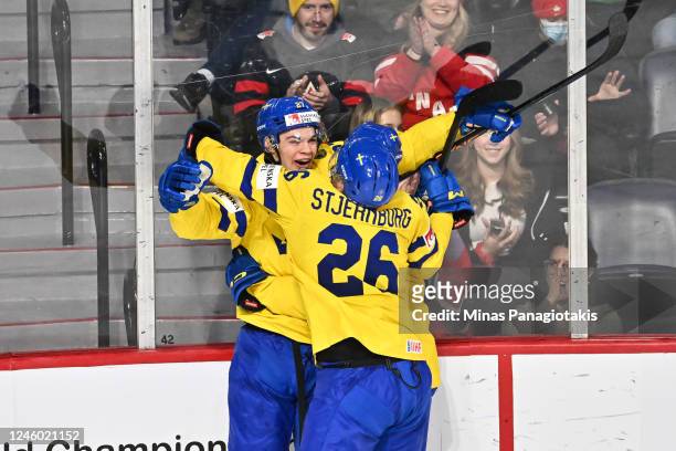 Oskar Pettersson of Team Sweden celebrates his goal with teammates Isak Rosen and Victor Stjernborg during the second period against Team United...