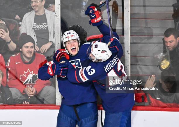 Chaz Lucius of Team United States celebrates his game-winning goal with teammate Luke Hughes during overtime in the bronze medal round of the 2023...