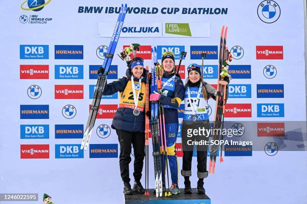 Gold medalist Elvira Oeberg of Sweden , silver medalist Julia Simon of France and bronze Dorothea Wierer of Italy celebrate on the podium during the...