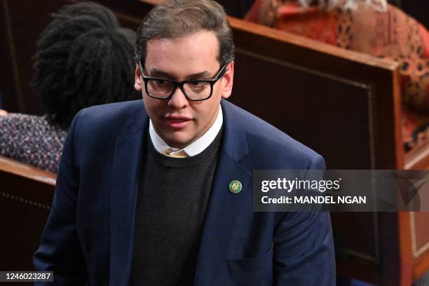 Representative George Santos walks through the House Chamber as the House of Representatives continues voting for new speaker at the US Capitol in...