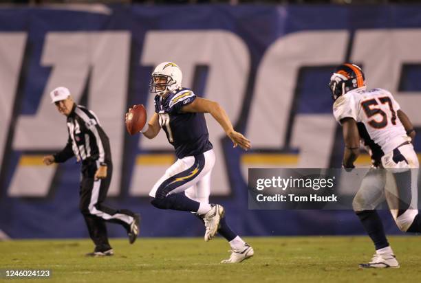 Phillip Rivers of the San Diego Chargers scrambles out of the pocket against the Denver Broncos at Qualcomm Stadium on November 22, 2010 in San...