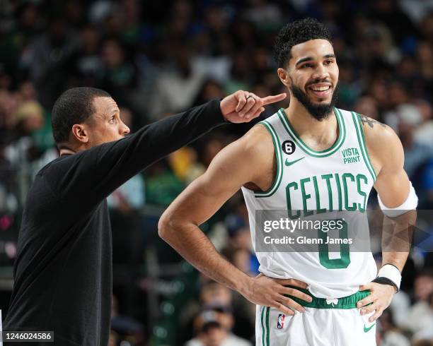 Head Coach Joe Mazzulla of the Boston Celtics directs Jayson Tatum as he smiles and looks on during the game against the Dallas Mavericks on January...