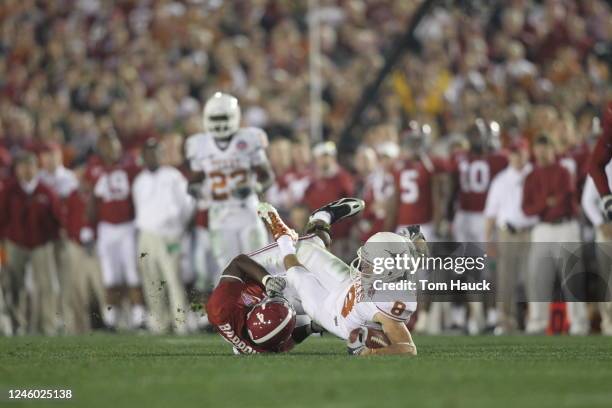 Jordan Shipley of the Texas Longhorns is hit by Mark Barron of the Alabama Crimson Tide. The Crimson Tide defeated the Longhorns 37-21 in the Citi...