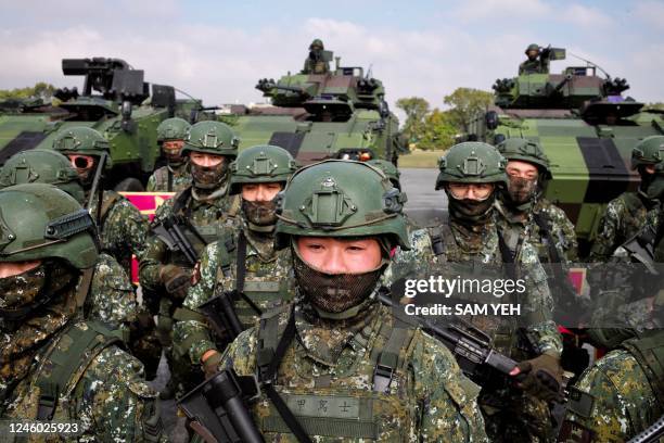 Taiwanese soldiers take part in a demonstration showing their combat skills during a visit by Taiwan's President Tsai Ing-wen at a military base in...
