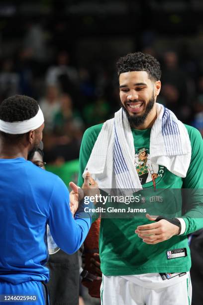 Jayson Tatum of the Boston Celtics high fives Kemba Walker of the Dallas Mavericks after the game on January 5, 2022 at the American Airlines Center...