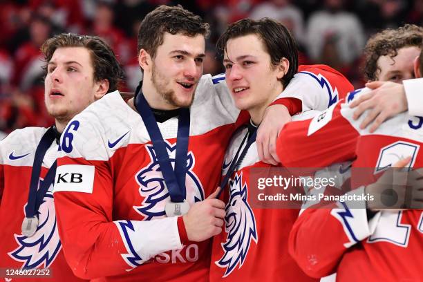 Marcel Marcel and Stanislav Svozil of Team Czech Republic hug it out after finishing second and losing to Team Canada 3-2 in overtime at the 2023...