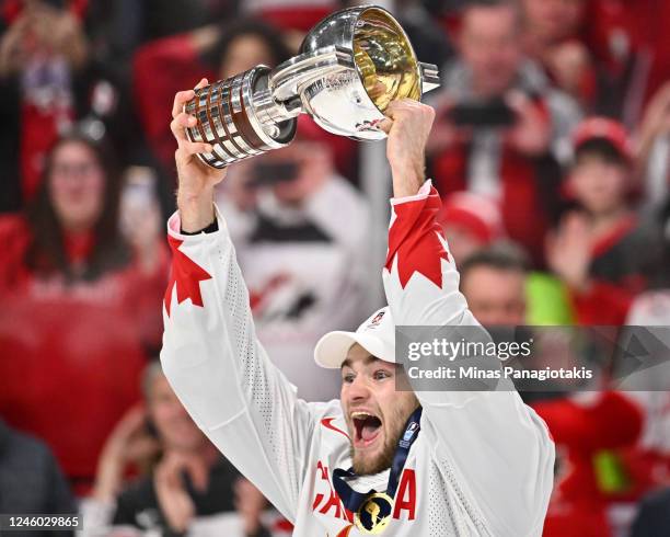 Shane Wright of Team Canada holds up the IIHF World Championship Cup after Team Canada defeated Team Czech Republic 3-2 in overtime to capture gold...