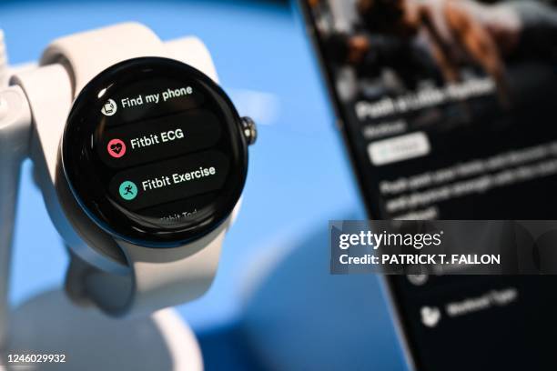 The Google Pixel Watch with Fitbit technology is demonstrated at Alphabets Google Android plaza booth during the Consumer Electronics Show in Las...