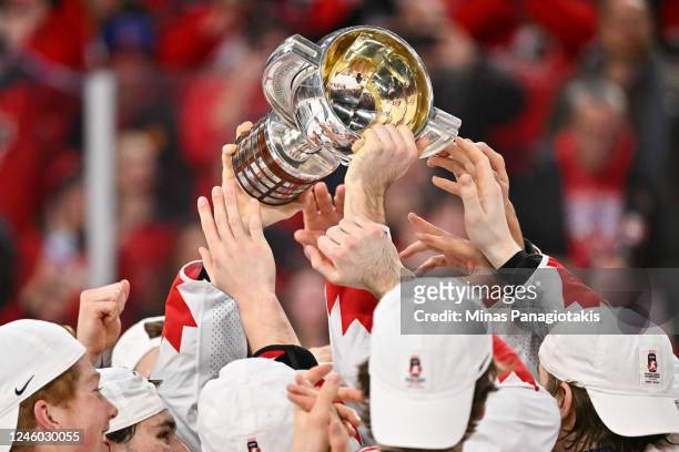 Team Canada hold up the IIHF World Championship Cup as they celebrate gold after defeating Team Czech Republic 3-2 in overtime at the 2023 IIHF World...