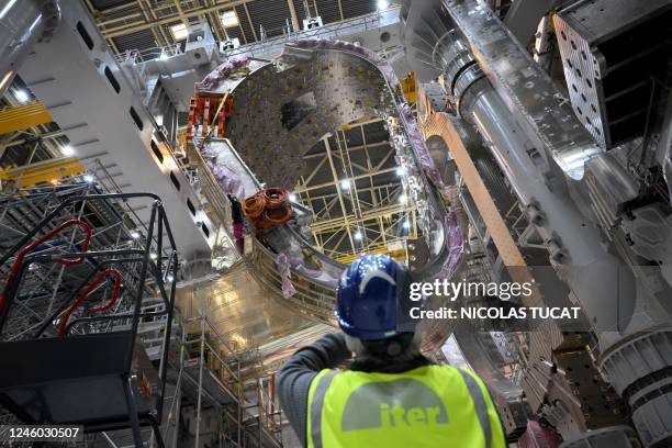 Man takes a picture of a module being assembled at the international nuclear fusion project Iter in Saint-Paul-les-Durance, southern France, on...