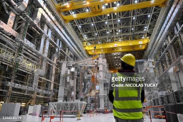 Man looks at a module being assembled at the international nuclear fusion project Iter in Saint-Paul-les-Durance, southern France, on January 5, 2023.