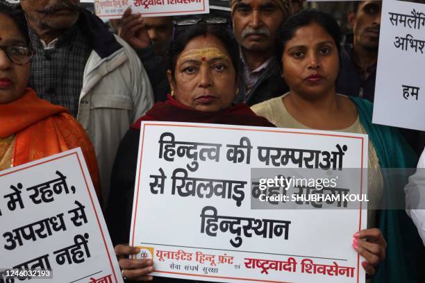 Activists protest against same-sex marriage during a hearing outside the Supreme Court in New Delhi on January 6, 2023.