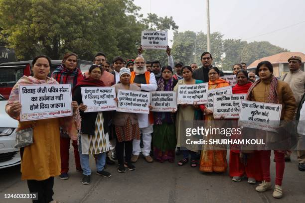 President of United Hindu Front Jai Bhagwan Goyal along with activists protest against same-sex marriage during a hearing outside the Supreme Court...