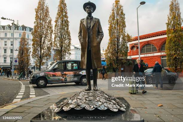 Passerby glances at a bronze statue of Hungarian composer Béla Viktor János Bartók on 23rd November 2022 in London, United Kingdom. The statue was...