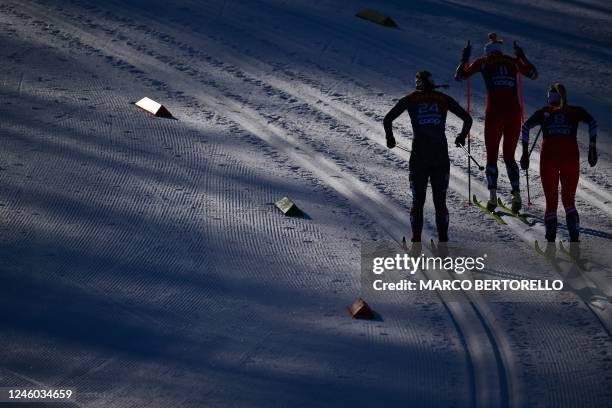 Czech Republic's Tereza Beranova, Norway's Astrid Oyre Slind and USA's Julia Kern compete in the Women's Sprint Classic event at the FIS Tour de Ski...